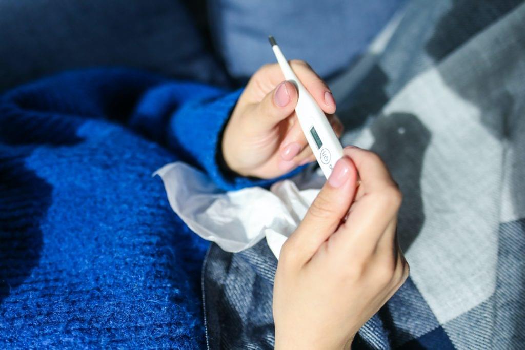 holding thermometer